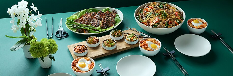 Tablescape of various korean inspired recipes