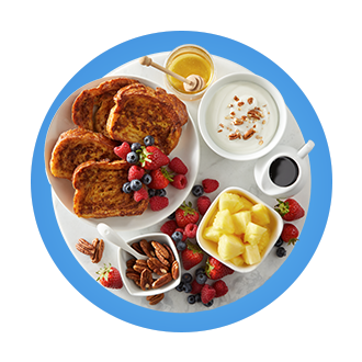 French toast, fruits, nuts, yogurt and honey.