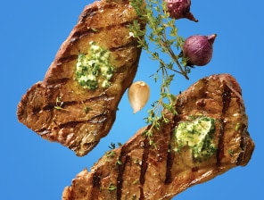 Grilled steak with herbs and spices.
