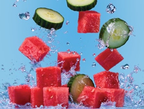 fresh watermelon cubes and cucum-ber slices with splashes of water