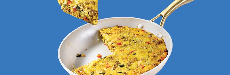 Frittata with zucchini, bell peppers, sausage and shredded mozzarella cheese